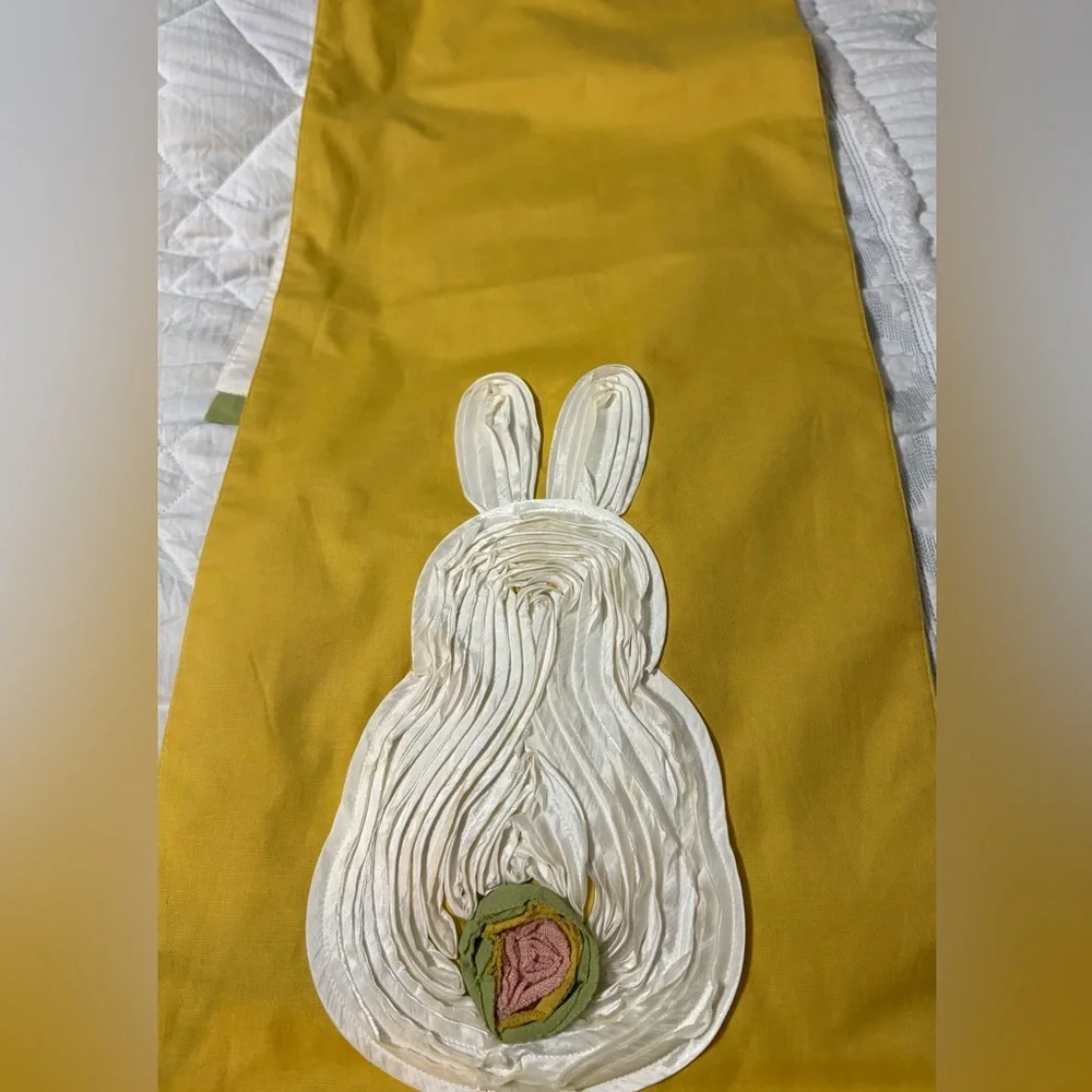 Cute bunny table runner by Pier 1 Imports. Golden yellow with cream bunnies.